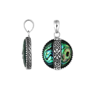 Handcrafted 925 Sterling Silver Abalone Shell round pendant featuring floral center pattern, mirror-polished finish, and iridescent tones with detailed Balinese silver artistry for wholesale buyers.