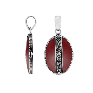 AP-62Handcrafted 925 Sterling Silver Red Coral oval pendant with detailed floral center design, mirror-polished finish, and traditional Balinese artistry for wholesale jewelry catalogs.66-CR Sterling Silver Pendant With Coral Jewelry Bali Designs Inc