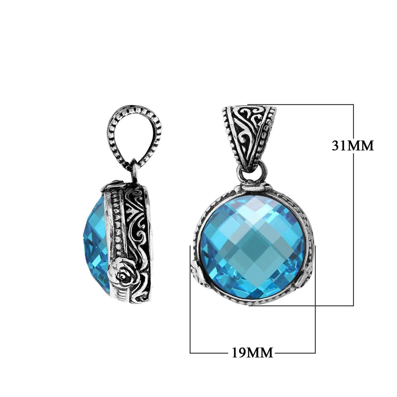 A beautifully crafted 925 sterling silver pendant featuring a faceted round Blue Topaz Quartz stone set in a traditional Balinese design with ornate detailing on the sides.
