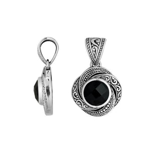 A detailed sterling silver pendant showcasing a polished Black Onyx surrounded by intricate swirl filigree, reflecting the timeless precision of Balinese silver artistry.
