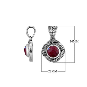 A stunning sterling silver pendant featuring a radiant Ruby Quartz encased in ornate swirl filigree design, showcasing authentic Balinese craftsmanship and artistic silver detailing.