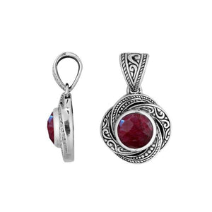 A stunning sterling silver pendant featuring a radiant Ruby Quartz encased in ornate swirl filigree design, showcasing authentic Balinese craftsmanship and artistic silver detailing.
