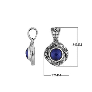 A handcrafted sterling silver pendant featuring a rich Sapphire Quartz surrounded by intricate swirl filigree detailing, reflecting the refined artistry of traditional Balinese jewelry design.