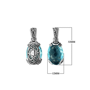 A handcrafted sterling silver pendant featuring a radiant Blue Topaz Quartz in an oval filigree design, reflecting classic Balinese artistry and polished detailing.