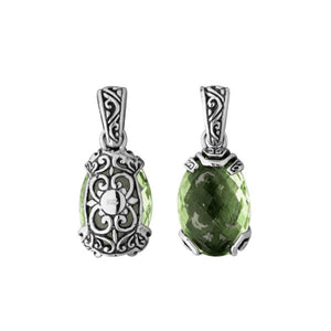 A handcrafted sterling silver pendant featuring a serene Green Amethyst Quartz framed in ornate Balinese filigree, reflecting artisan detail and classic silver elegance.