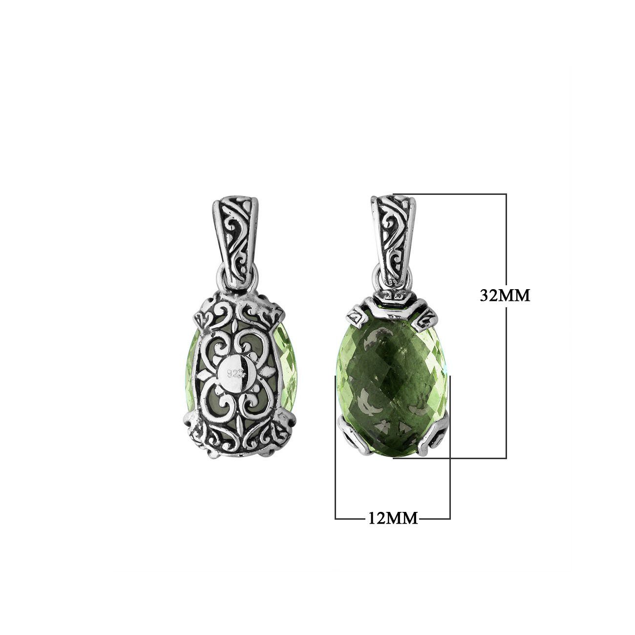 A handcrafted sterling silver pendant featuring a serene Green Amethyst Quartz framed in ornate Balinese filigree, reflecting artisan detail and classic silver elegance.