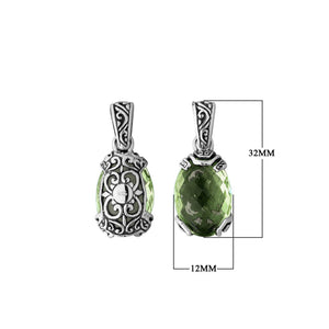 A handcrafted sterling silver pendant featuring a serene Green Amethyst Quartz framed in ornate Balinese filigree, reflecting artisan detail and classic silver elegance.