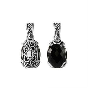 A handcrafted sterling silver pendant featuring a faceted Black Onyx stone framed in ornate Balinese filigree, showcasing detailed silver craftsmanship and elegance.