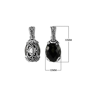 A handcrafted sterling silver pendant featuring a faceted Black Onyx stone framed in ornate Balinese filigree, showcasing detailed silver craftsmanship and elegance.