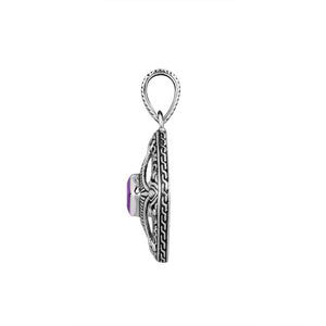 A handcrafted sterling silver pendant featuring vibrant Amethyst Quartz in an ornate square filigree frame, showcasing detailed Balinese silver artistry.
