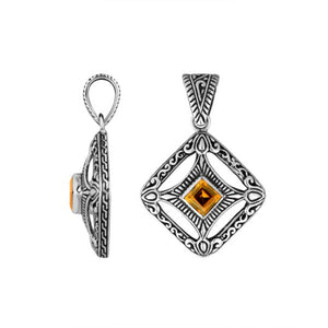 A handcrafted sterling silver pendant featuring a golden Citrine Quartz in an ornate Balinese filigree frame, showcasing fine silver artistry and elegance.