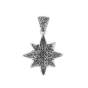 A handcrafted sterling silver compass star pendant featuring detailed Balinese tribal engraving and polished silver craftsmanship.