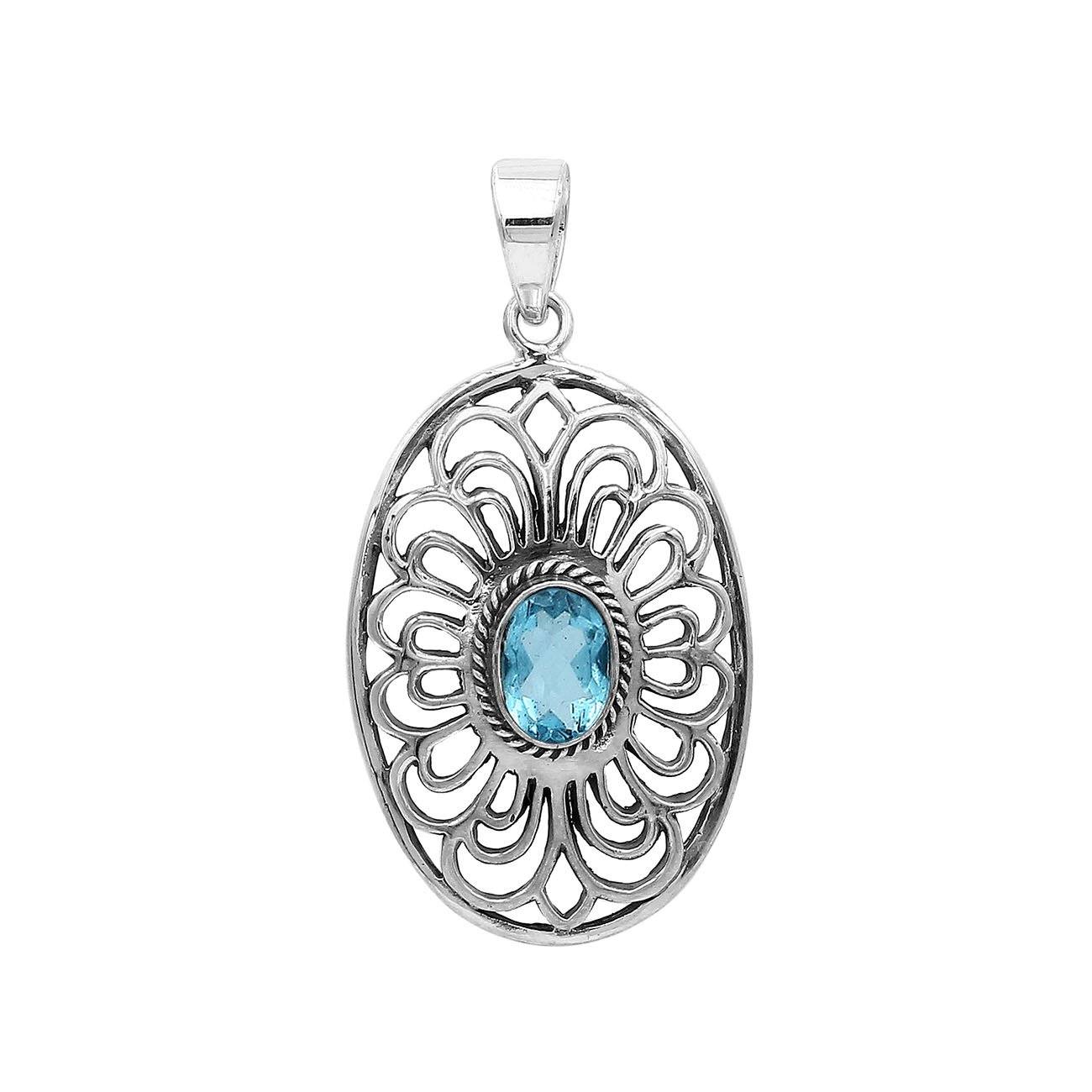 A handcrafted sterling silver pendant featuring a radiant Blue Topaz Quartz gemstone centered in an elegant Balinese filigree oval frame.