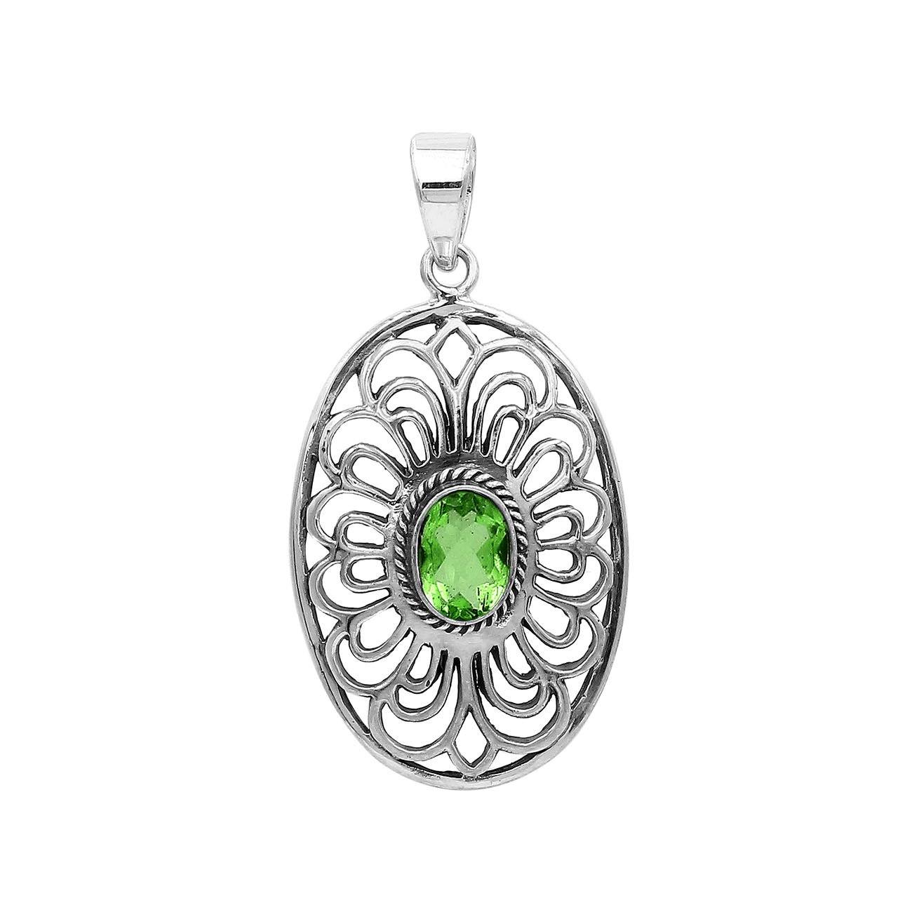 Handcrafted sterling silver pendant with Peridot Quartz in an oval Balinese filigree frame and polished silver finish.