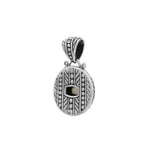 Round sterling silver pendant featuring radiant citrine quartz cushion centerpiece, fine leaf detailing, and smooth high-gloss polish in elegant Balinese craftsmanship.