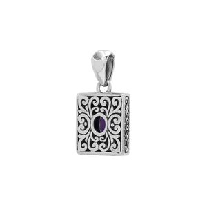 Rectangular sterling silver pendant featuring an oval amethyst quartz, detailed swirl patterns, and a smooth polished finish with traditional Balinese craftsmanship.