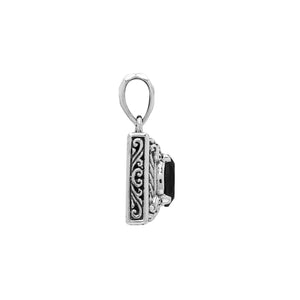 Rectangular sterling silver pendant featuring oval black onyx quartz centerpiece with swirl engravings and polished Balinese silver detailing.