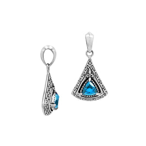 Triangular sterling silver pendant featuring trillion-cut blue topaz quartz with geometric engraving and polished Balinese finish.