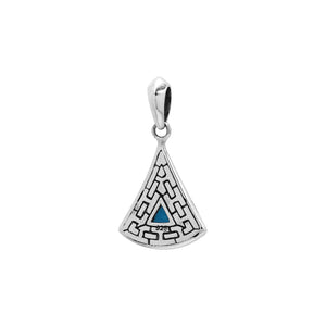 Triangular sterling silver pendant featuring trillion-cut blue topaz quartz with geometric engraving and polished Balinese finish.