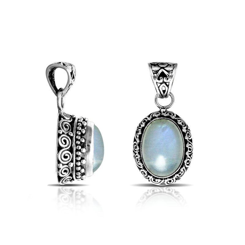 Sterling silver oval pendant with Rainbow Moonstone and oxidized Balinese filigree handcrafted detailing.
