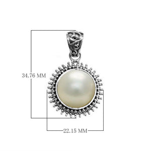 Sterling silver round pendant with Mabe Pearl and oxidized Balinese beaded handcrafted frame.