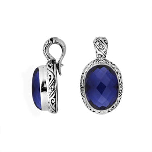 Sterling silver pendant featuring a faceted Blue Sapphire Quartz set in a carved Balinese frame with a polished glossy finish.