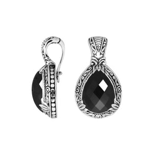 Sterling silver pendant showcasing a faceted Black Onyx teardrop set in a carved Balinese frame with a glossy polished finish.
