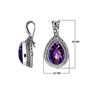 Sterling silver pendant featuring a faceted Amethyst Quartz teardrop set in a carved Balinese frame with a glossy polished finish.