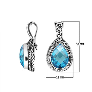 Sterling silver teardrop pendant featuring faceted Blue Topaz Quartz set in a carved Balinese frame with a polished glossy finish.