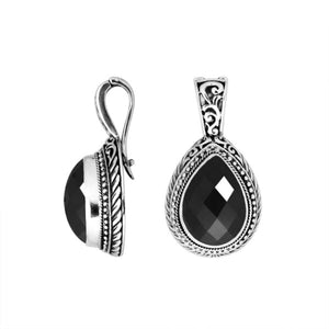 Sterling silver teardrop pendant featuring faceted Black Onyx set in a carved Balinese frame with a polished high-gloss shine.