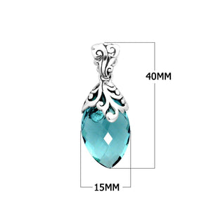 Sterling silver marquise pendant featuring a faceted Blue Topaz Quartz center adorned with intricate Balinese filigree carvings and a polished decorative frame.