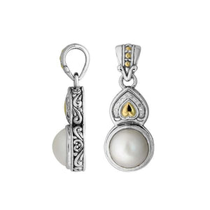 Teardrop silver pendant with pearl, gold details, and diamond accents