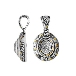 A wholesale sterling silver and 18K gold oval sunburst pendant featuring a diamond-studded center, oxidized Balinese engraving, and two-tone artisan detailing ideal for bulk jewelry buyers.