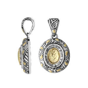 A wholesale sterling silver and 18K gold oval halo pendant featuring a hammered gold center, diamond accents, and detailed Balinese engraving with oxidized textures ideal for bulk jewelry buyers.