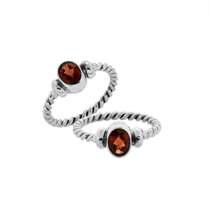 Bulk sterling silver twisted band rings with oval faceted Garnet Quartz, handcrafted 925 silver wholesale jewelry supply.