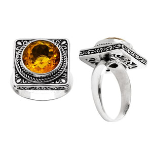 Sterling silver wholesale ring with a round citrine quartz set in a square ornate frame, handcrafted in Bali.