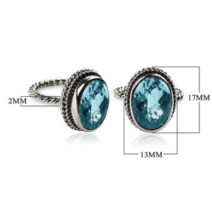 Sterling silver oval Blue Topaz Quartz ring with bezel setting and rope-style band design.