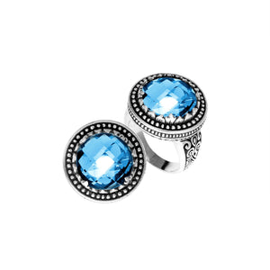 Sterling silver ring with faceted Blue Topaz Quartz, beaded halo, and Balinese carvings handcrafted in Bali.