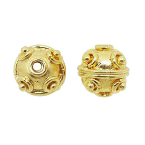 Handcrafted round 18K gold overlay copper spacer bead with raised decorative dots, made in India for wholesale jewelry production.