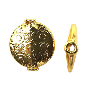 Handcrafted flat disc bead with embossed circular pattern and 18K gold overlay over copper, made in India for wholesale jewelry production.
