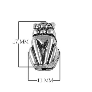 Silver overlay over copper charm handcrafted in India with owl design and oxidized silver finish