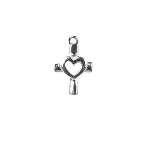 Handcrafted silver overlay cross charm with cutout heart made of silver overlay over copper in India.
