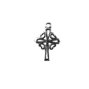 Handcrafted silver overlay ornate cross charm made with silver overlay over copper featuring decorative scroll design in India.