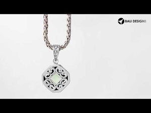 A handcrafted sterling silver pendant featuring a faceted Green Amethyst Quartz in a geometric Greek key frame, showcasing intricate Balinese silver artistry.