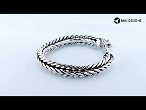 Two-view product image of a double-braided sterling silver bracelet with an engraved decorative clasp on a white background.