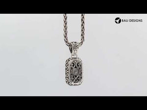 Sterling silver rectangular pendant featuring Black Onyx centerpiece with traditional Balinese beaded frame and oxidized detailing.