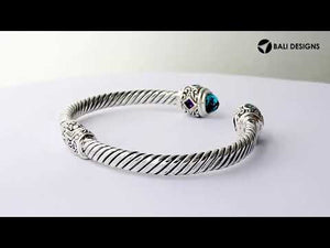 Sterling silver twisted bangle with Amethyst Quartz and Blue Topaz Quartz handcrafted in Bali.