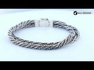 Two-view product image of a sterling silver double-braided bracelet with a rectangular Mother of Pearl inlay clasp, shown on a white background.