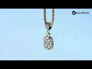 Square silver floral pendant with gold and diamond accents