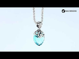 Handcrafted 925 Sterling Silver Blue Topaz Quartz pendant with intricate swirl filigree pattern, mirror-polished surface, and Balinese-inspired marquise shape design for wholesale jewelry suppliers.